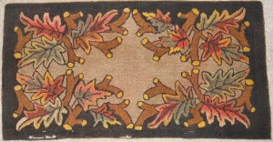 Charming old rug with extensive damage and wear