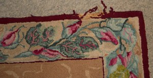 1930's rug with damage on the edge